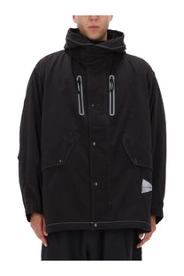 And wander men’s fishtail octa black hooded jacket with reflective zipper pulls and triangular brand tag on sleeve