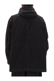 And wander men’s fishtail octa jacket black with black hood and contrasting white stitching along seams and pockets