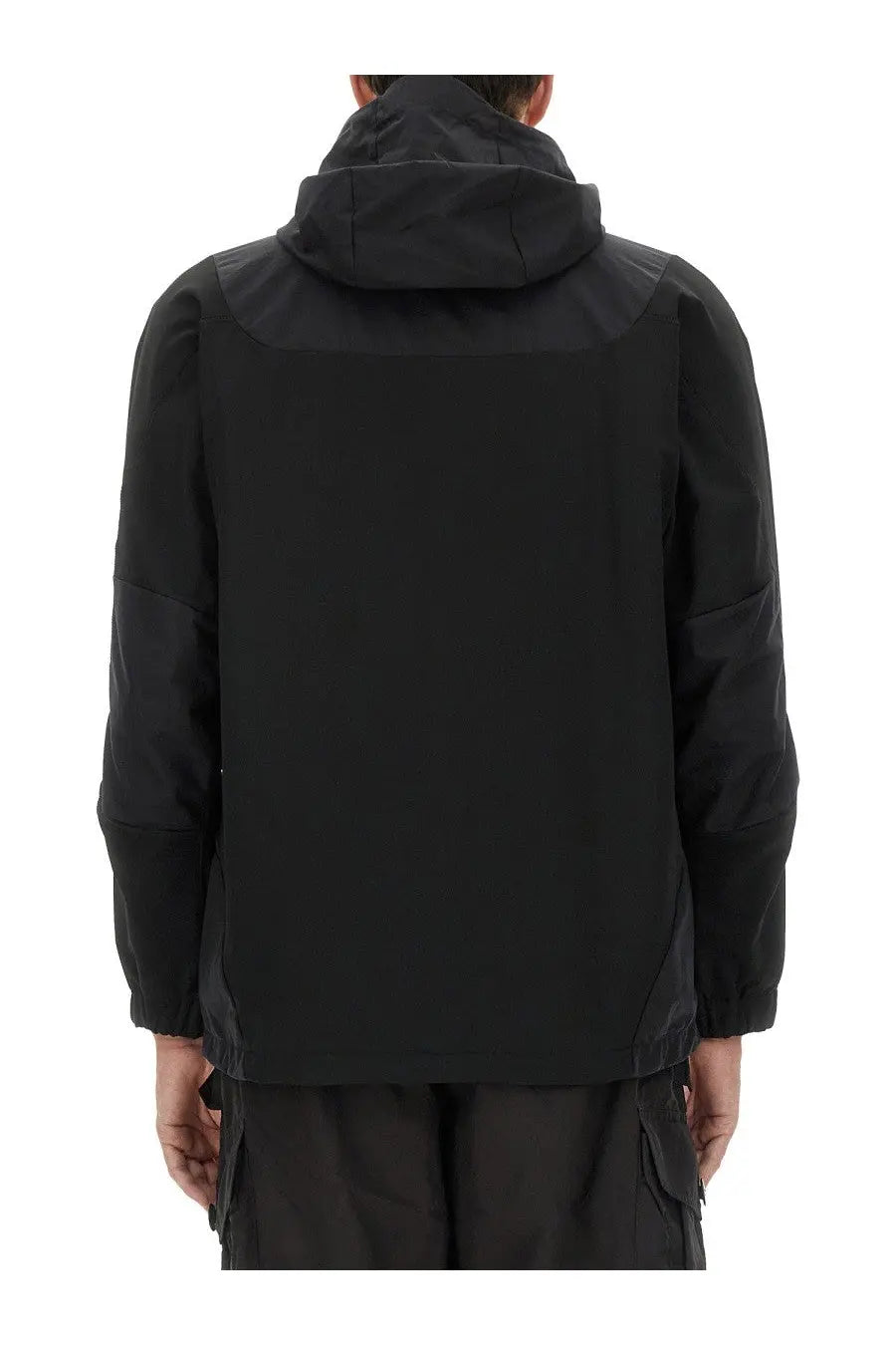 And wander men’s hooded jacket in black with sleek modern design and subtle paneling details viewed from the back