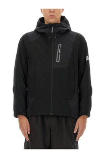 And wander men’s hooded jacket black with subtle gray zipper accents and sleek modern design in lightweight material