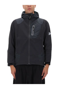 Men’s jacket grey by and wander with dark gray hooded design subtle reflective zipper and small triangular sleeve logo