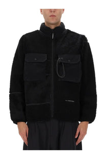 Men’s and wander black mix boa jacket with shearling trim, two front pockets, and zipper closure utility style