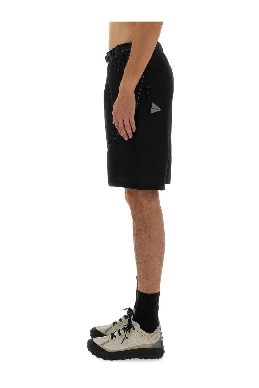 And wander men’s black nylon shorts with a subtle gray triangular logo on the side pocket