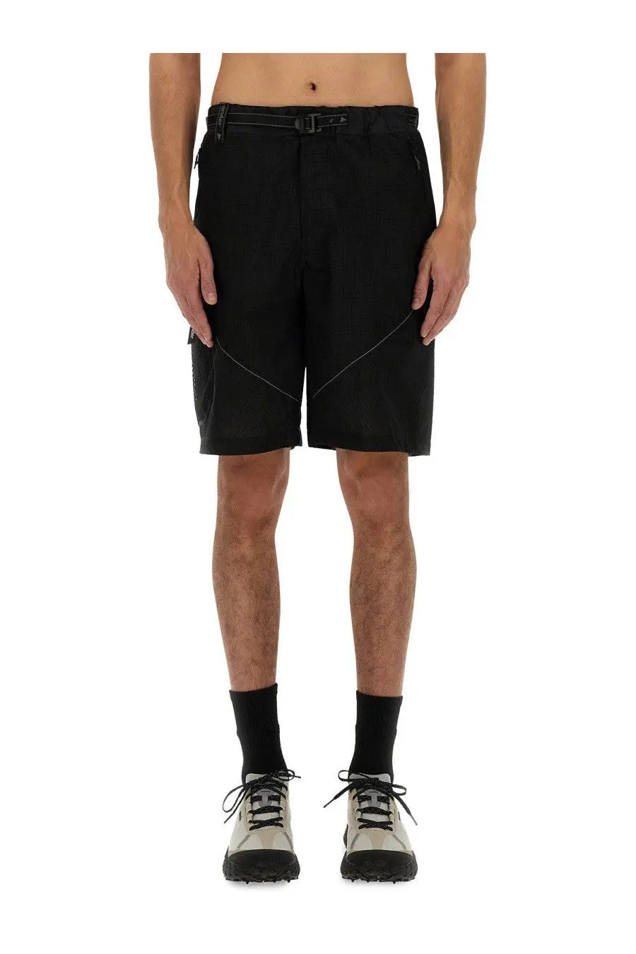 And wander men’s nylon shorts in black feature a tactical design with contrasting white stitching for utility use