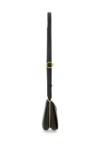 Wandler women’s Kate bag black is a black leather crossbody bag with gold-tone hardware and a minimalist design