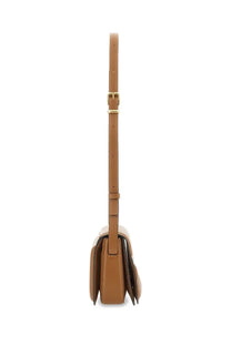 Tan leather crossbody bag with gold tone buckle and adjustable strap wandler women’s medium oscar trunk bag brown