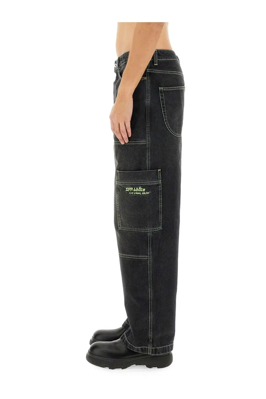 Off-white men’s black denim cargo jeans with contrasting white stitching and yellow off-white logo front pocket