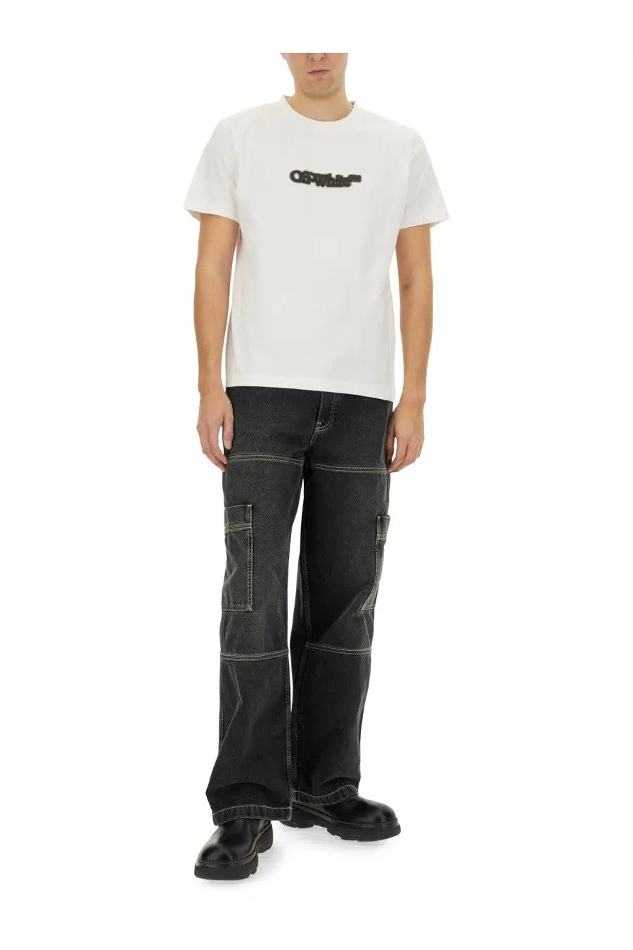Off-white men’s cargo jeans black paired with a white off-white t-shirt featuring a black logo across the chest