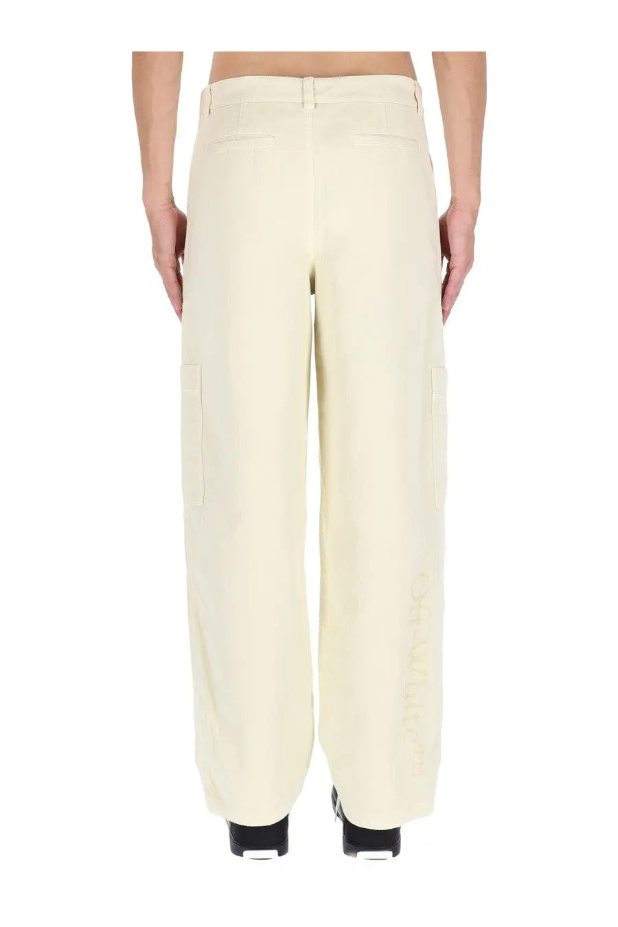 Off-white men’s beige cargo pants in cream wide-leg design with side pockets and subtle embroidery on outer leg