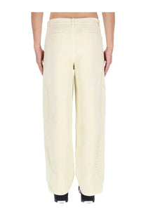 Off-white men’s beige cargo pants in cream wide-leg design with side pockets and subtle embroidery on outer leg