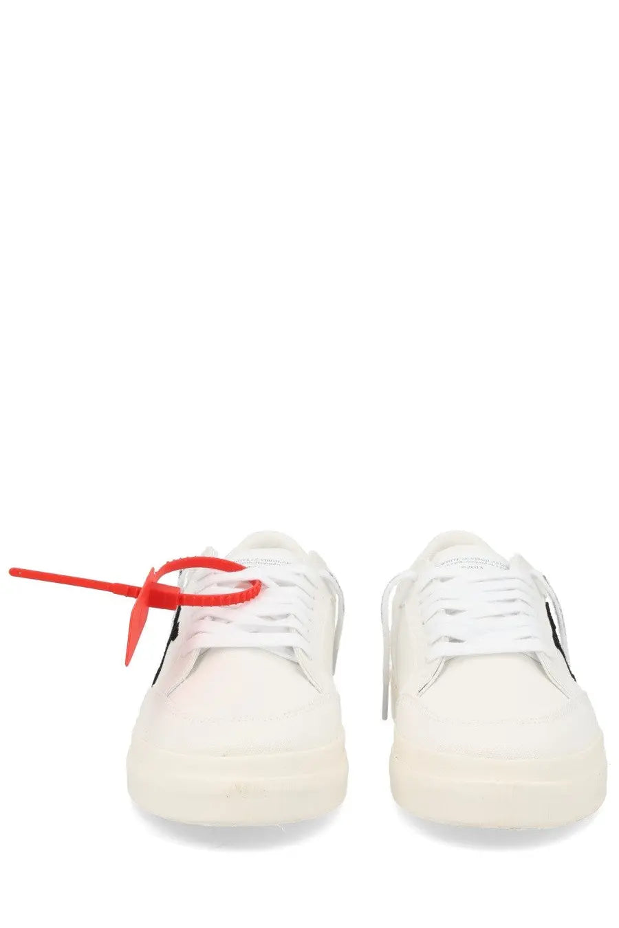 Off-white men’s sneaker vulc low white canvas with bold red zip tie threaded through the laces