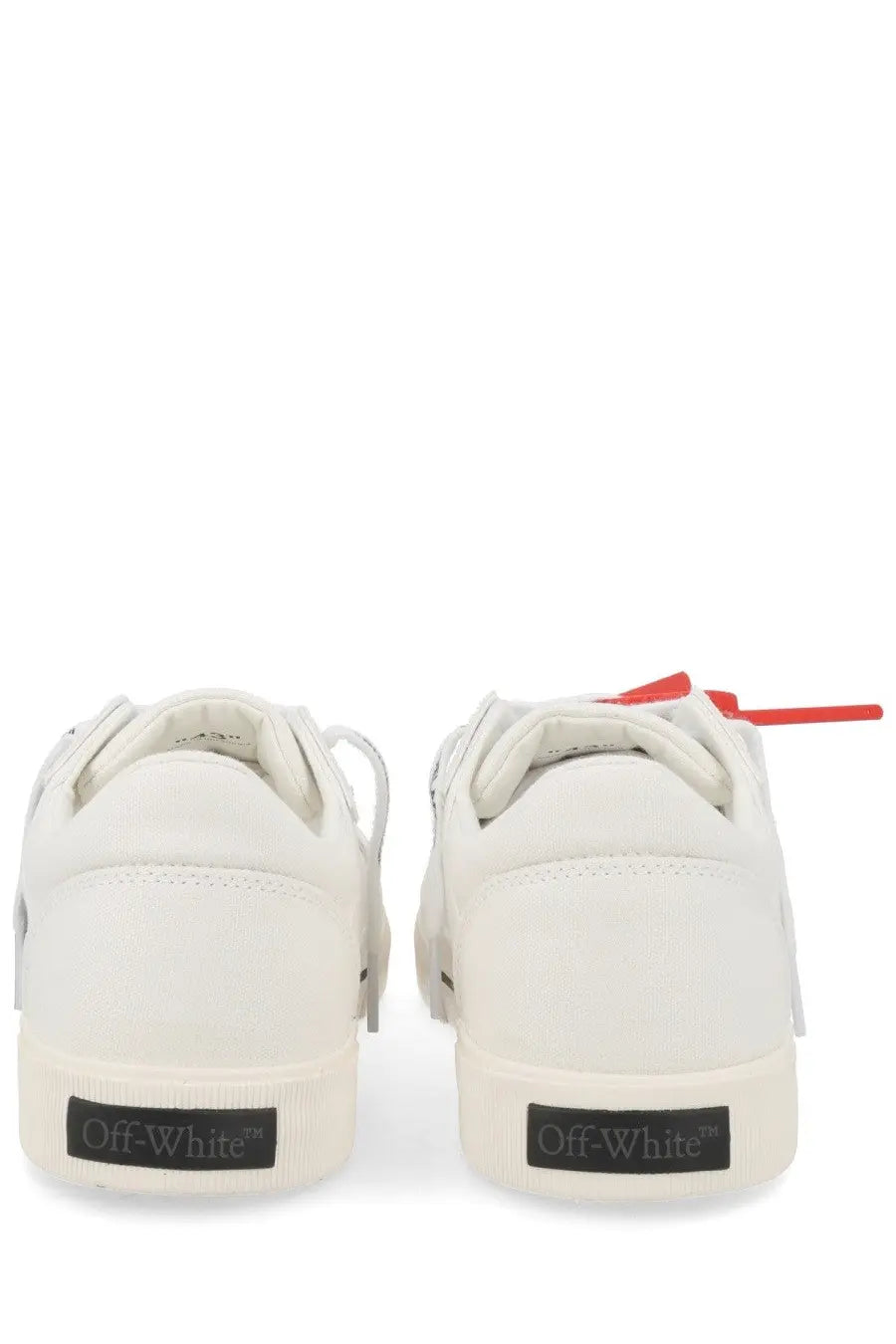 Off white men sneaker vulc low white showing back side with white off white sneakers red laces and black heel branding