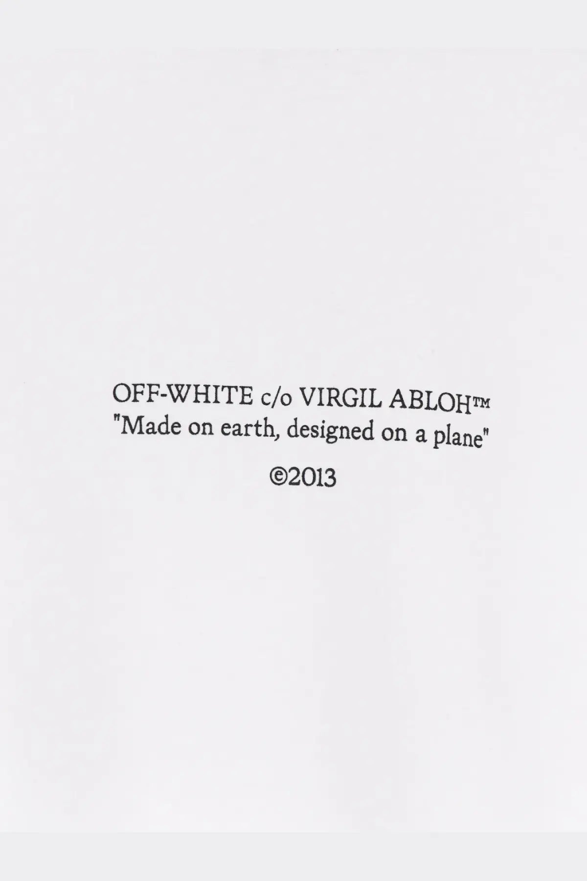 Off white men’s statement cotton shirt white showing off white c o virgil abloh logo tag with black text on white background