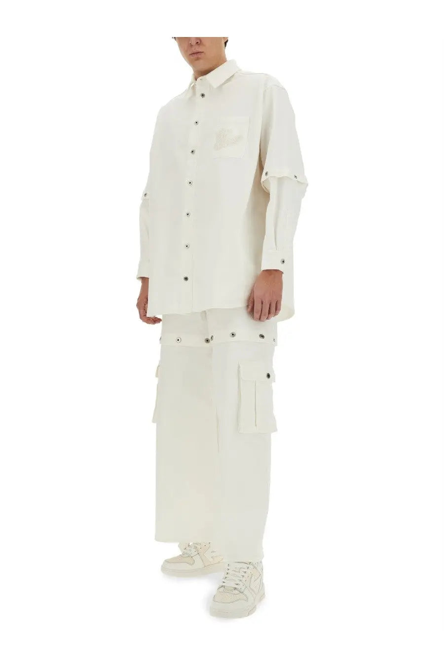 Off-white men’s super baggy jeans white paired with a minimalist white button-up shirt with layered sleeves and black buttons