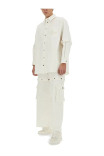 Off-white men’s super baggy jeans white paired with a minimalist white button-up shirt with layered sleeves and black buttons