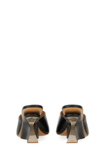 Off-White women’s black leather mules with sleek geometric heel and tan insole for stylish everyday wear