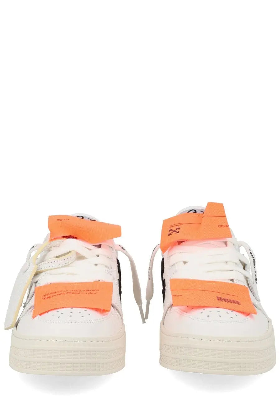 Off-white women’s low top court sneaker with bright orange strap accents and black detailing