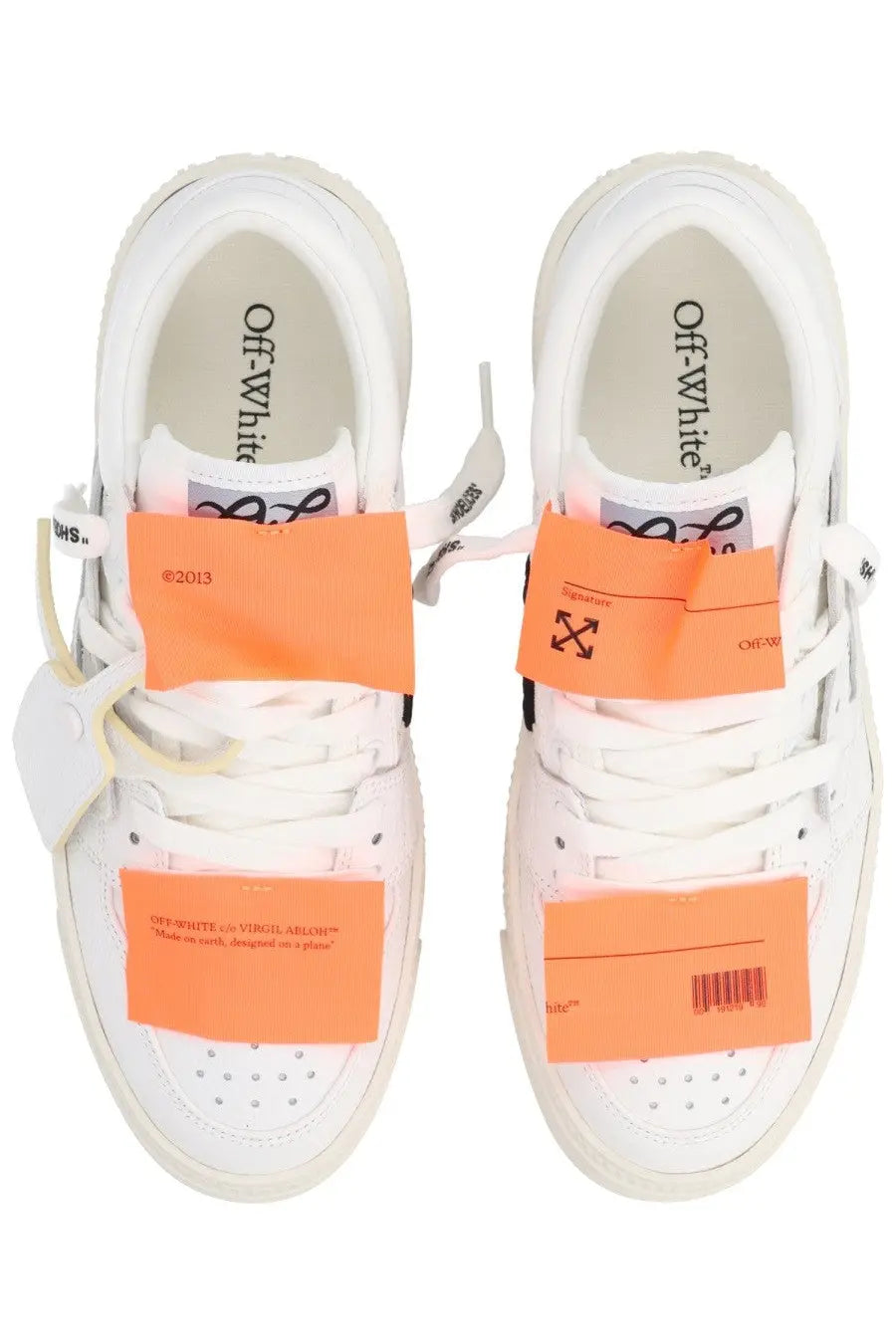 Off-white women’s low top court sneaker in white with orange label accents and black logo details