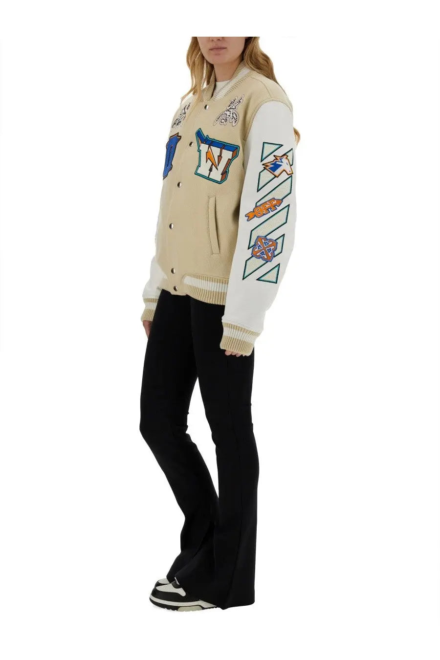 Off-White women’s beige varsity jacket with white accents featuring colorful embroidered patches and geometric designs