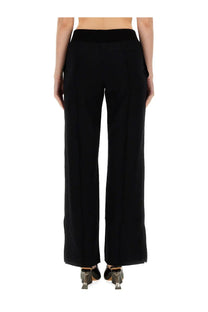 Off-White women’s black wide leg pants with high-waisted elasticated waistband and subtle side pockets