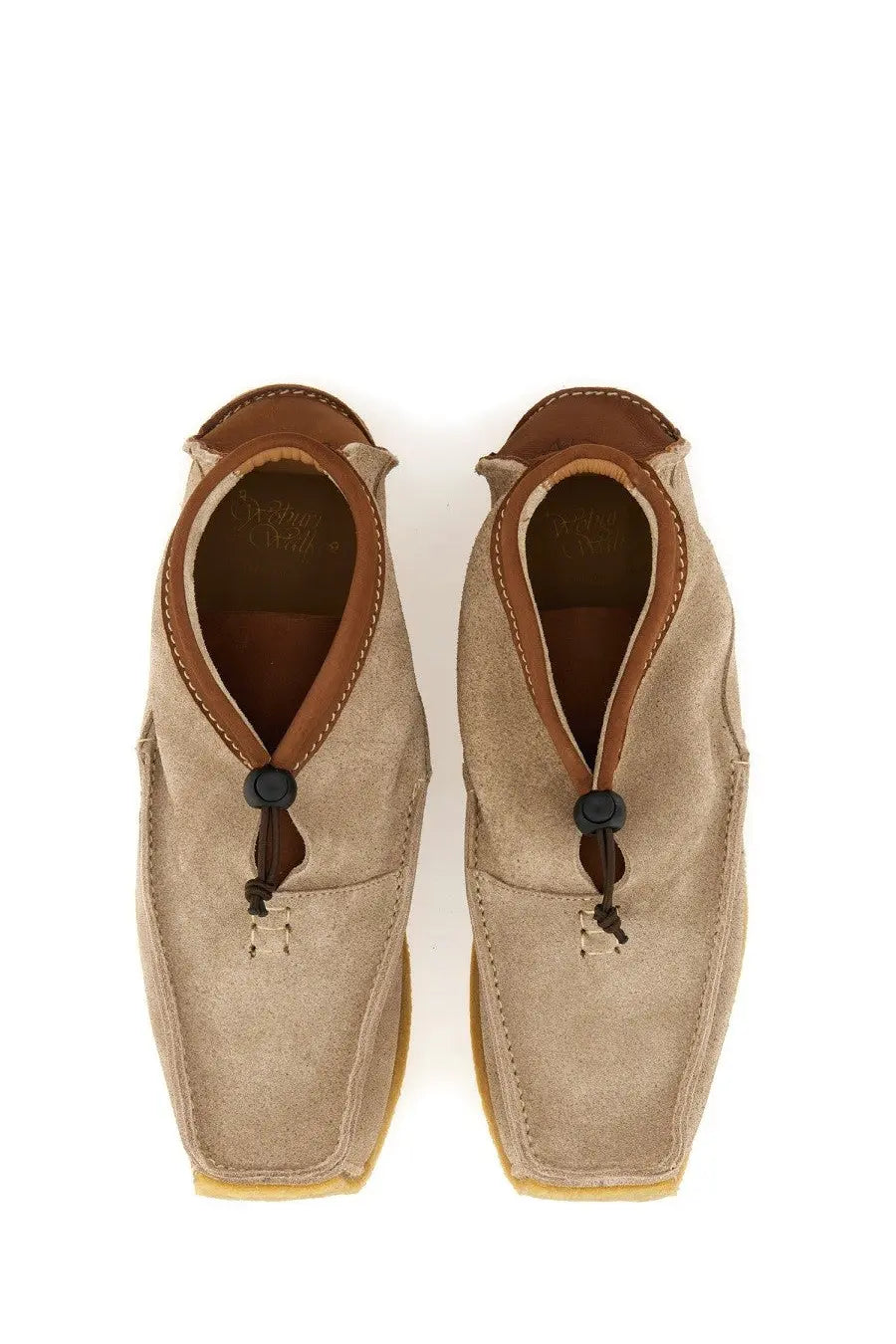 Beige suede slip-on men’s loafer with brown leather accents and black toggle closures woburn walk leather loafer