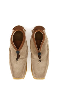 Beige suede slip-on men’s loafer with brown leather accents and black toggle closures woburn walk leather loafer