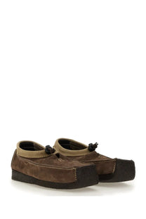 Woburn Walk men’s suede loafer brown with slip-on design black rubber sole tan leather accents and black tassels front detail