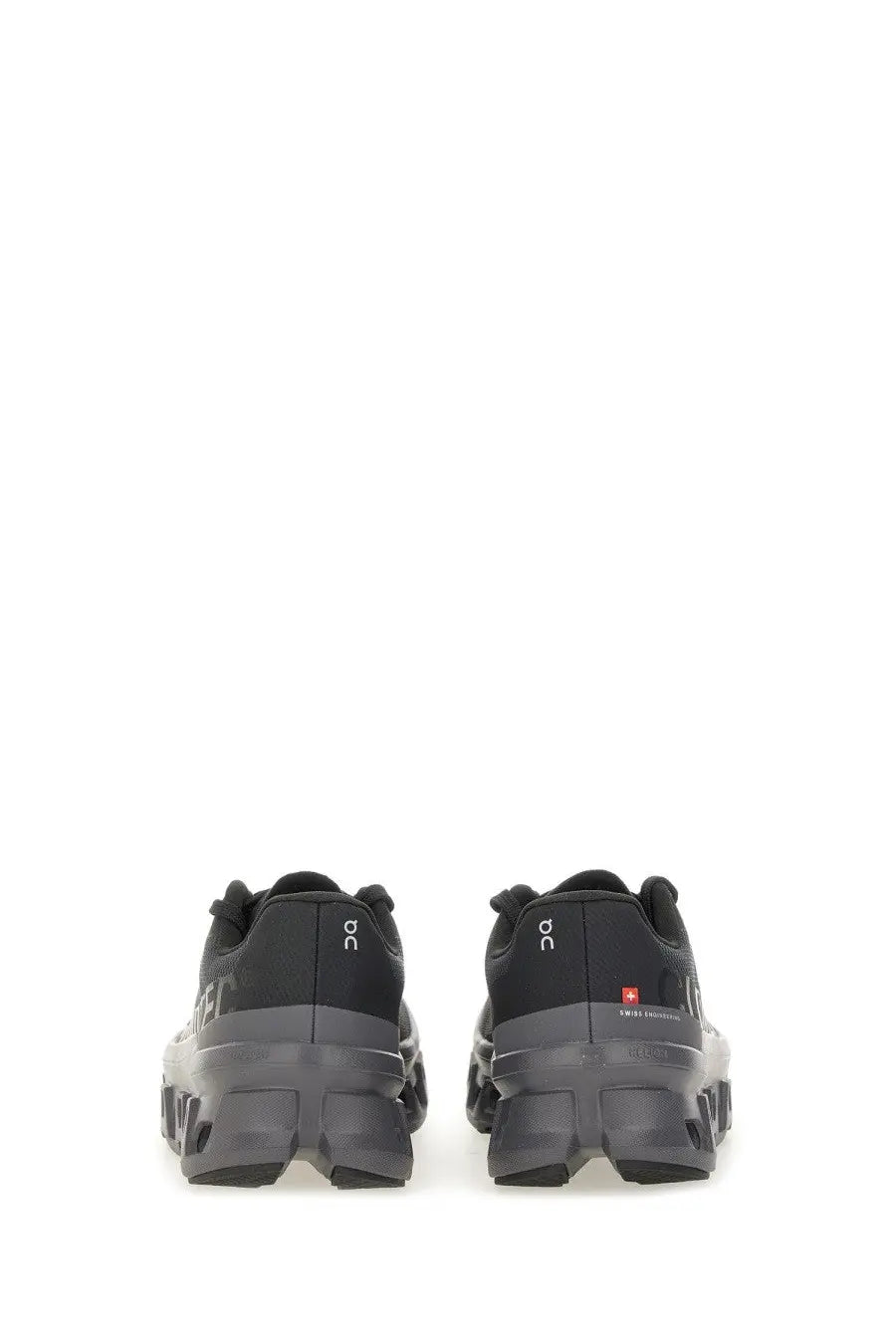 On women’s Cloudmonster sneaker black trail running shoes with rugged chunky sole and subtle branding details