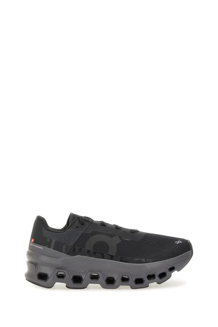 On women’s cloudmonster sneaker black with mesh upper and honeycomb patterned midsole running shoe by Onitsuka Tiger