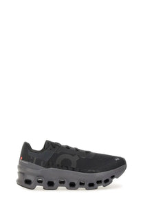 On women’s cloudmonster sneaker black with mesh upper and honeycomb patterned midsole running shoe by Onitsuka Tiger