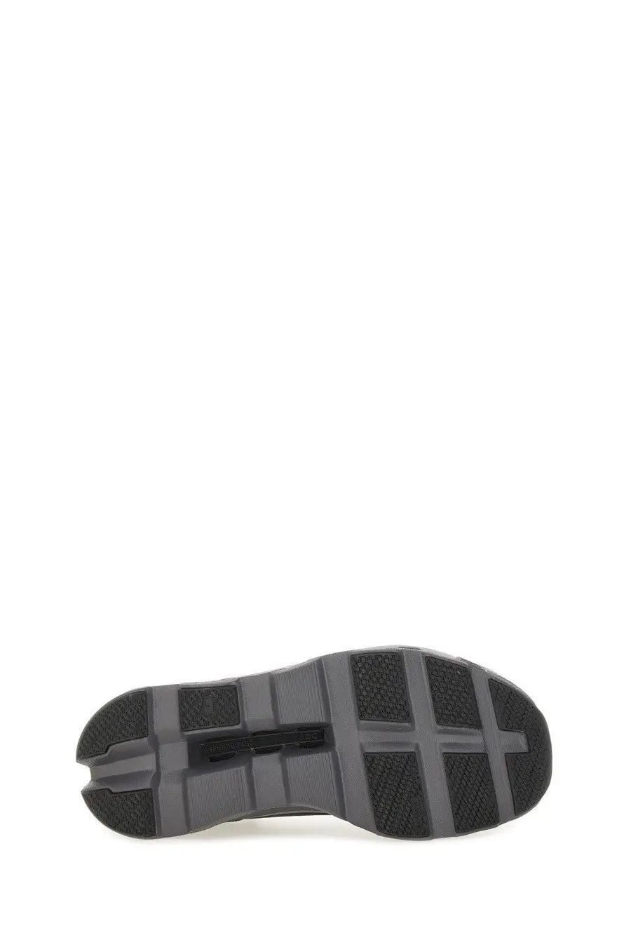 Black rubber sole with textured grid pattern and reinforced heel of on women’s cloudmonster sneaker black shown from back