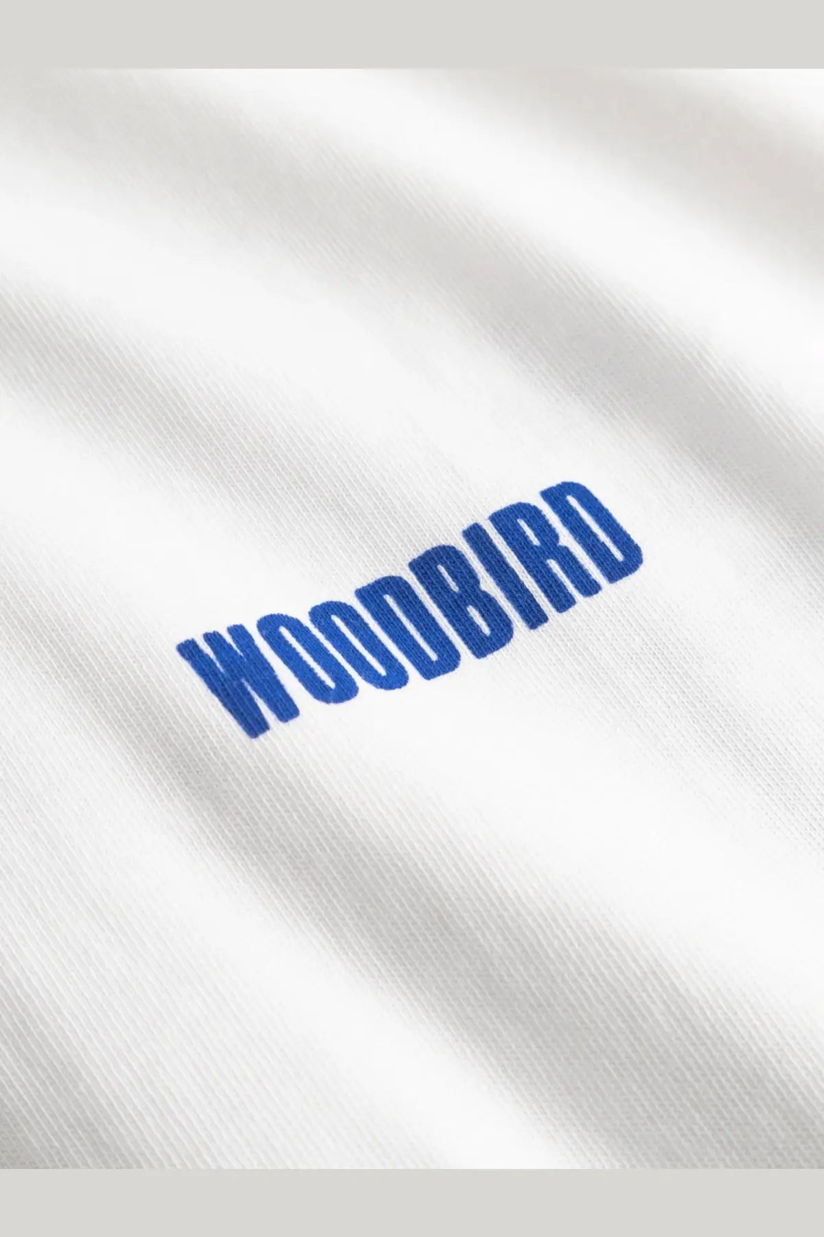 White cotton woodbird men’s t-shirt with blue embroidered logo on the front