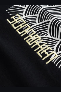 Woodbird men’s black cotton sweatshirt with bold white wave pattern and cream embroidered text on front side