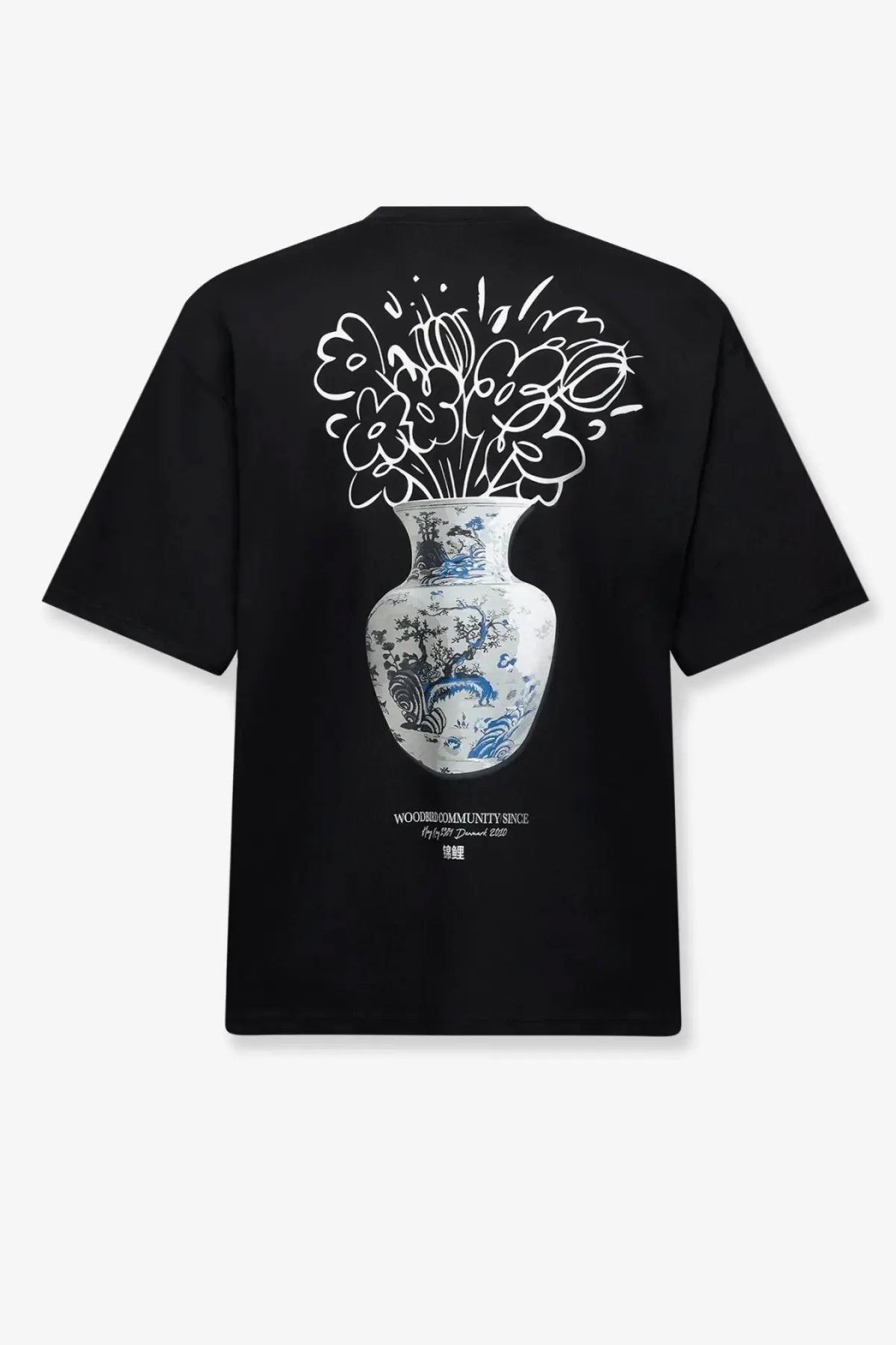Back of a black woodbird men’s ming tee organic cotton shirt with a detailed white and blue floral vase graphic