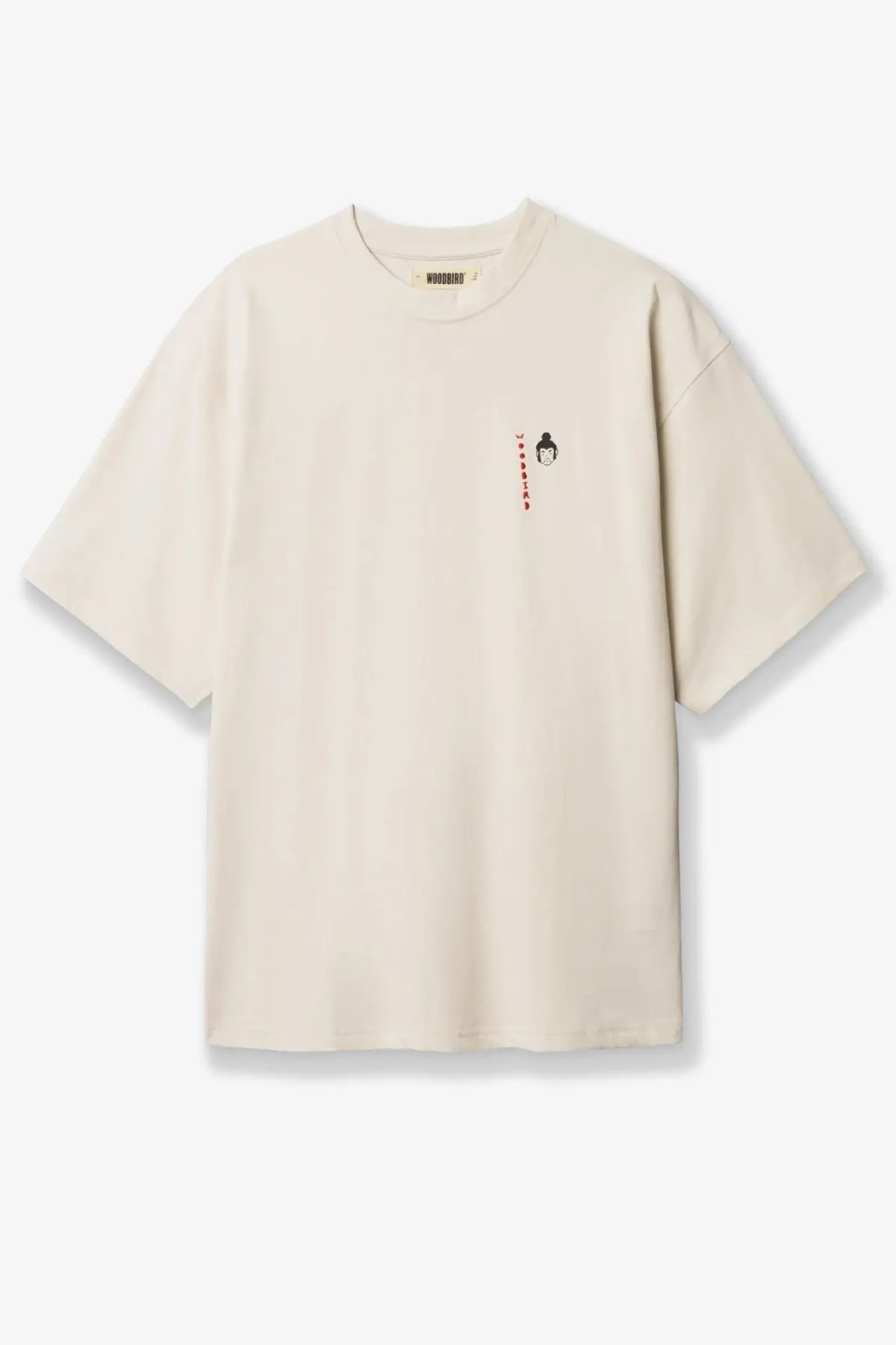 Cream-colored Woodbird men’s cotton oversized t-shirt with small embroidered face and red text on left chest