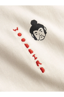 Woodbird mens cream cotton t-shirt with black embroidered buddha head and red stitched lettering in white color