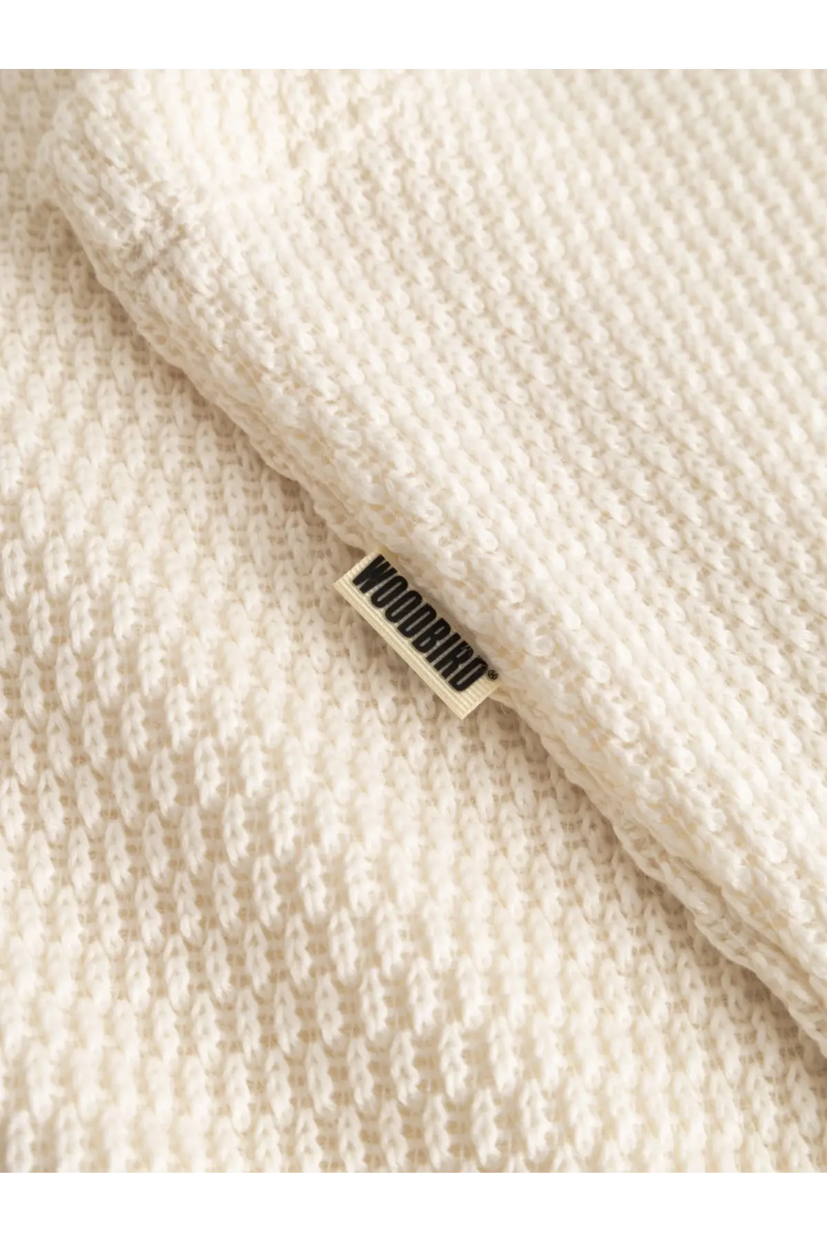 Cream-colored textured knit blanket with visible woodbird brand tag paired with woodbird mens wblung viscose blend tank top white