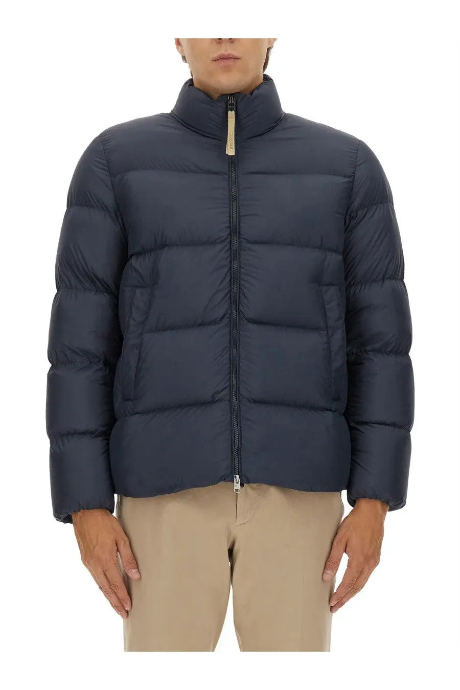 Dark blue quilted woolrich men’s down jacket with high collar and zipper closure in cloud blue color