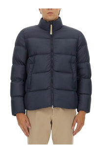 Dark blue quilted woolrich men’s down jacket with high collar and zipper closure in cloud blue color