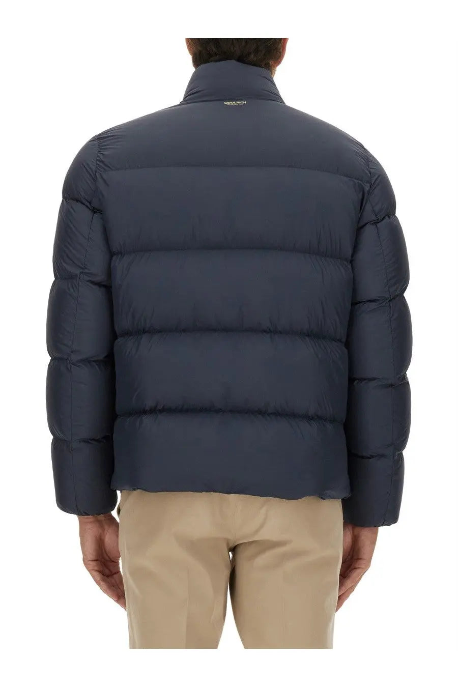 Woolrich men’s down jacket in cloud blue with dark blue quilted puffer design and high collar features horizontal stitching