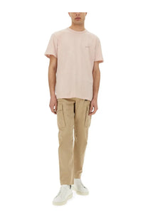 A soft pink short-sleeved crew neck t-shirt with subtle embroidery on the left chest for casual wear