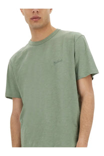 Woolrich men’s flamed cotton shirt green is a soft olive green short-sleeved crew neck t-shirt with embroidered logo