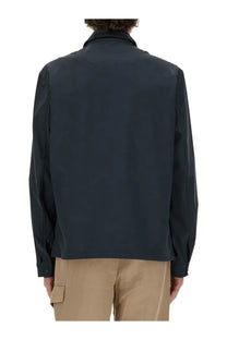 Woolrich men’s dark navy blue wool jacket with sleek modern design and subtle seam detailing front view