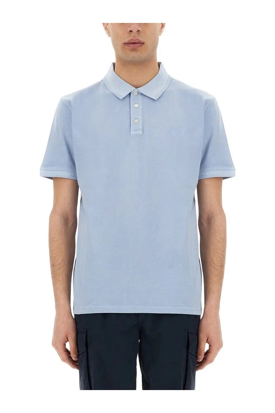 Light blue Woolrich men’s Mackinack polo shirt with short sleeves and subtle embroidered logo on chest