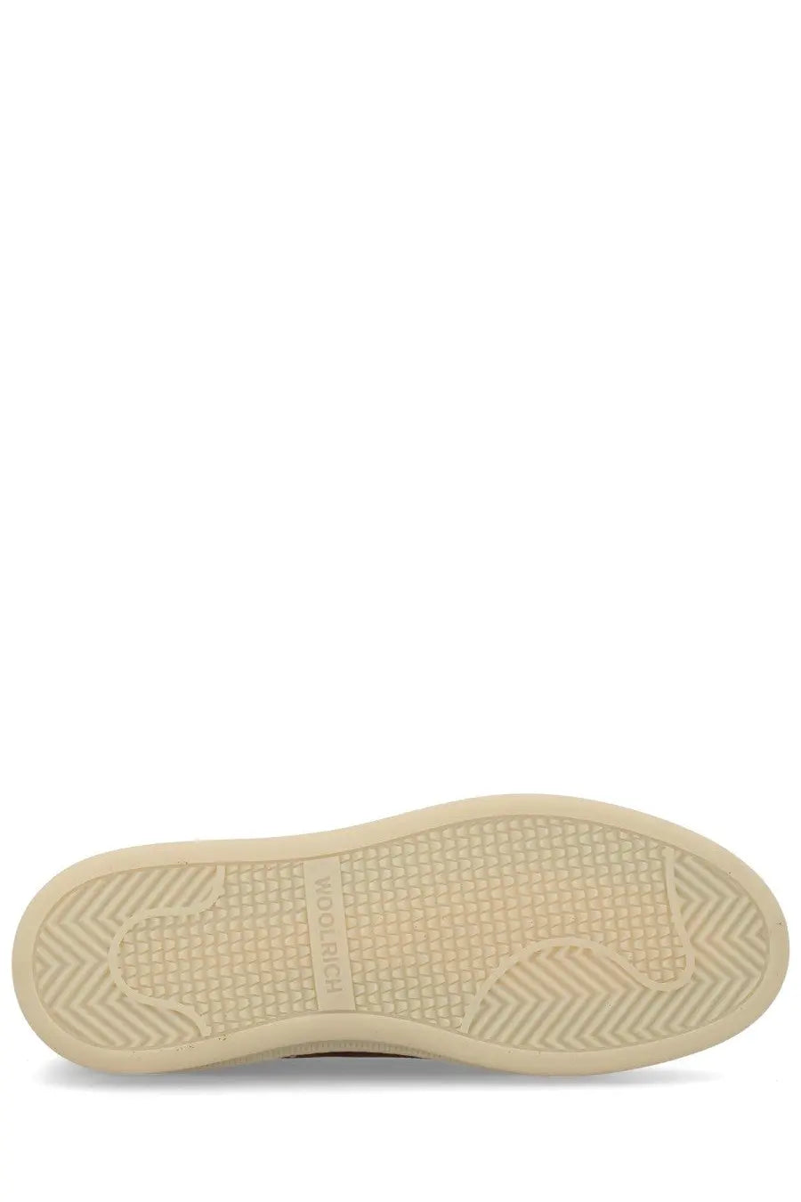 Back side of woolrich men’s mocassino in suede brown featuring cream-colored rubber sole with textured herringbone pattern