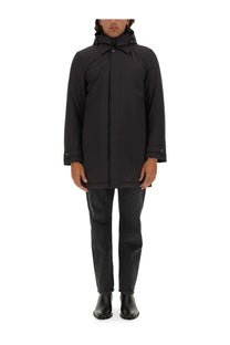 Woolrich men’s black nylon jacket with sleek minimalist design and subtle button details front view