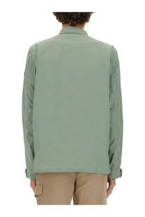 Woolrich men’s nylon shirt in green featuring a sleek sage green utility jacket style with structured collar and seam detailing
