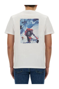Woolrich men’s white cotton t-shirt with a printed graphic of a climber with an orange backpack on snow mountains