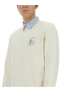 Woolrich men’s cream-colored wool sweatshirt with subtle blue embroidered logo on the chest