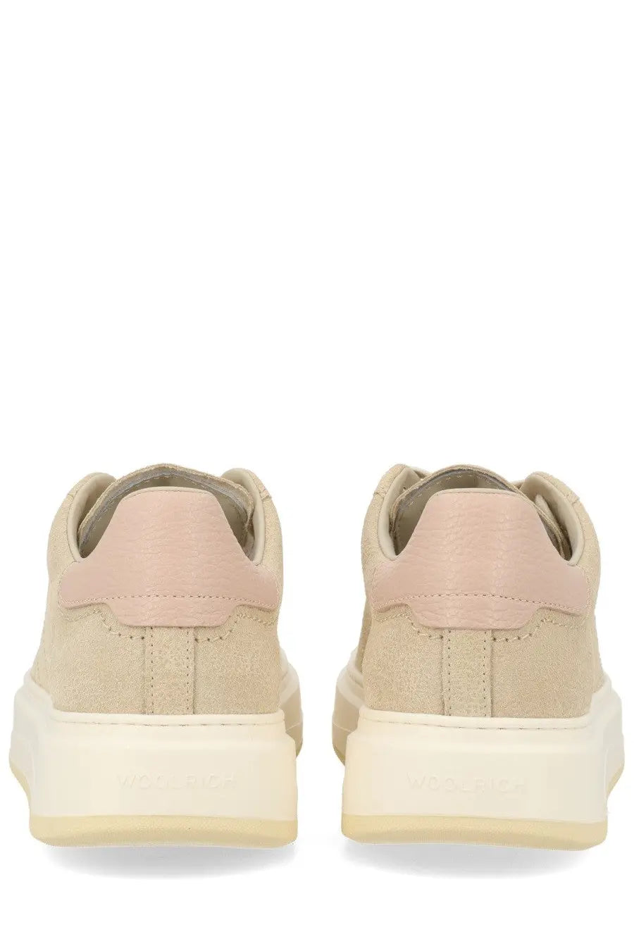 Woolrich women’s sneaker in beige suede with soft pink heel tab and cream-colored chunky sole shown from the back